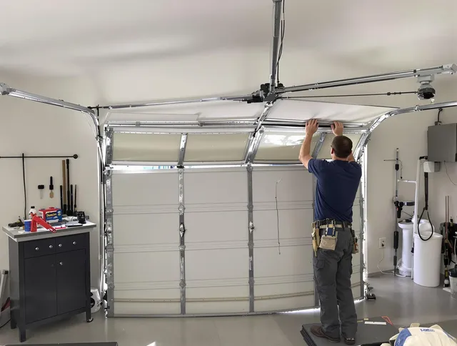 Bedford Garage Door Repair specialist performing precise section replacement on Bedford garage door